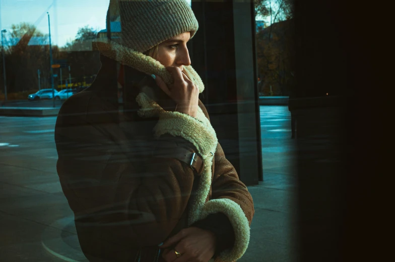 a man talks on the phone while on his phone