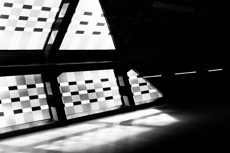 a room with many windows and a checkered pattern