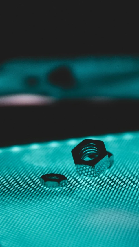 two rings laying side by side on a blue table