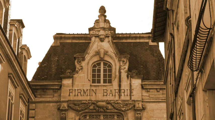 an old building with many windows and a sky background