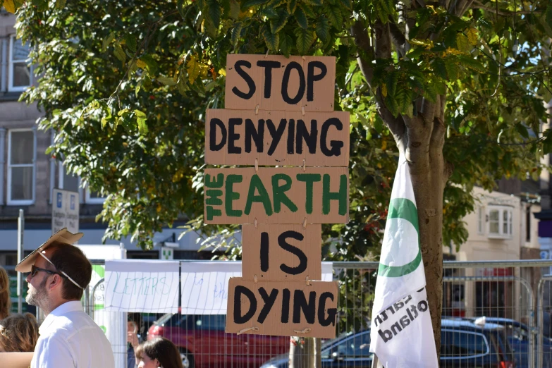 a person holding a sign in the street