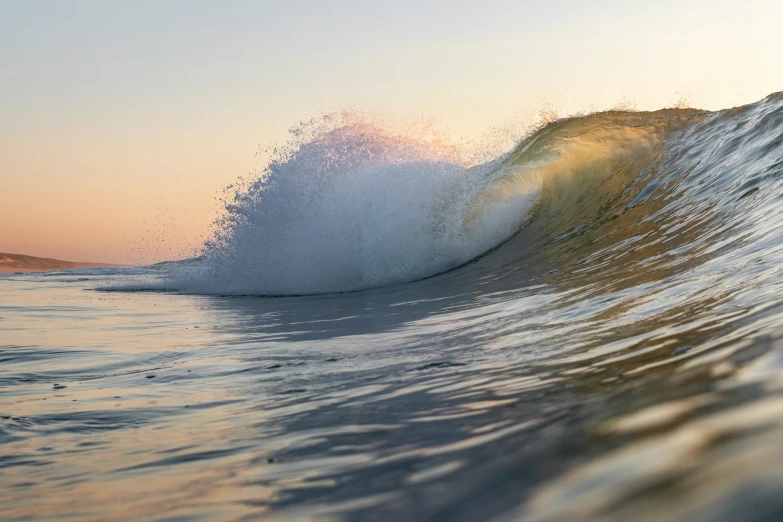 the waves are hitting against the backdrop of water