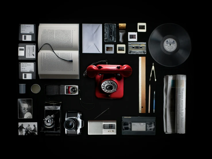 an image of a table with electronics and magazines