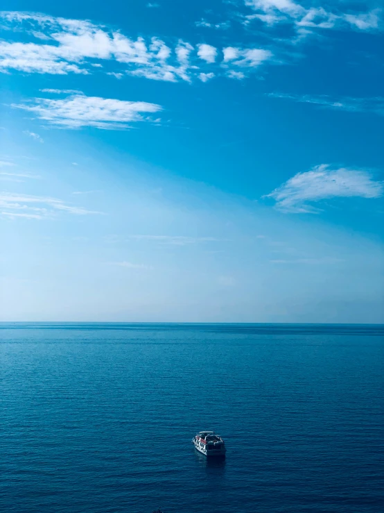 an image of the ocean and sky as seen from a boat