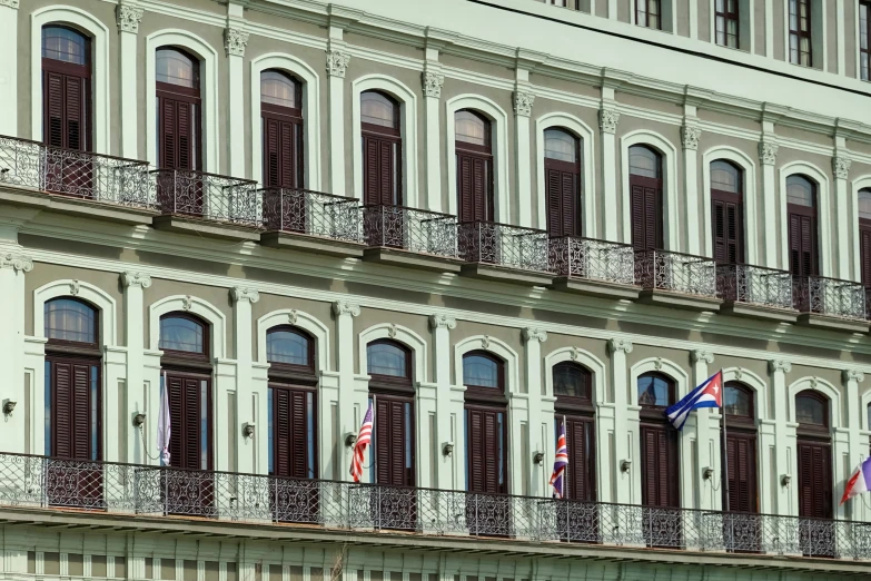 a building that has an iron balcony and balconies