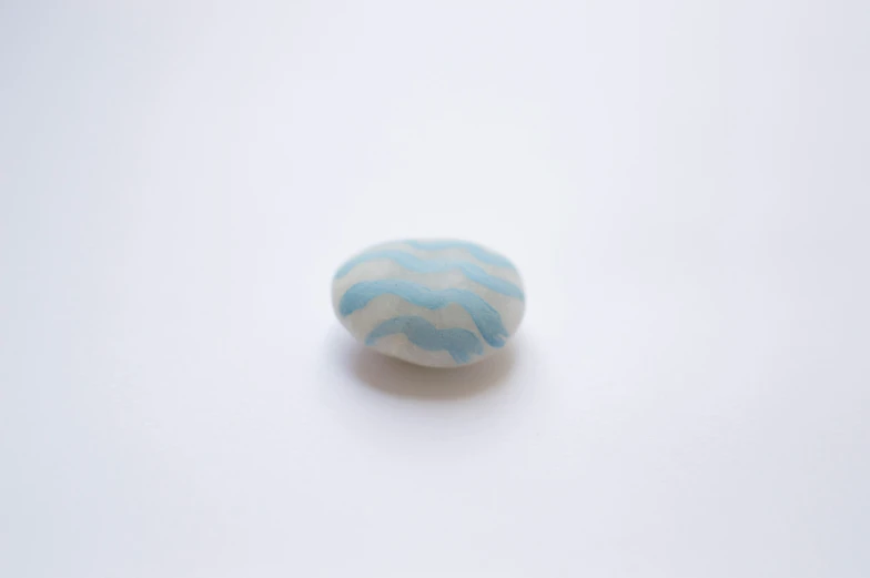 a close up of a marble ball with an abstract design