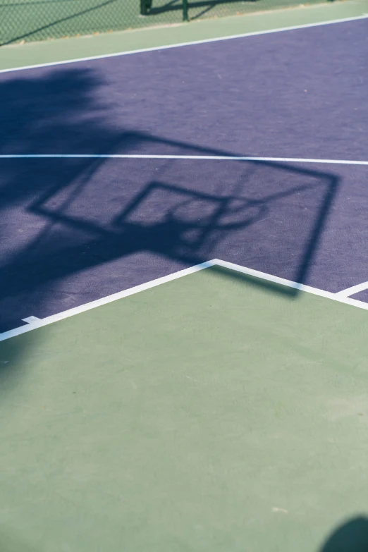 a tennis player's shadow on the court in tennis