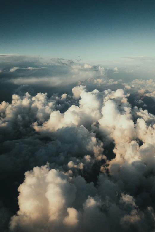 an aerial s of clouds over water and sky