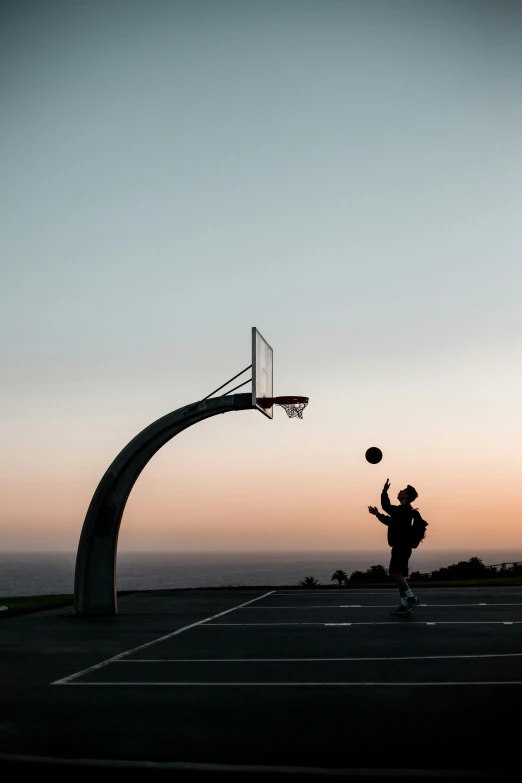 a person is getting ready to dunk a basketball