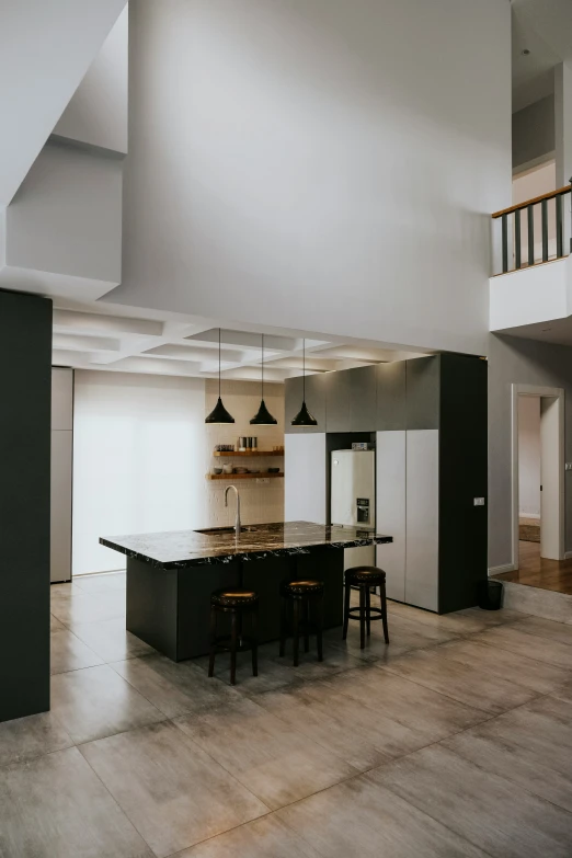 a large open living room and dining area with white walls