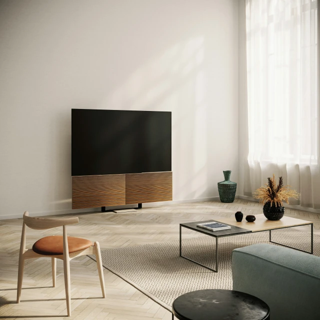 a black screen tv in a room with white walls