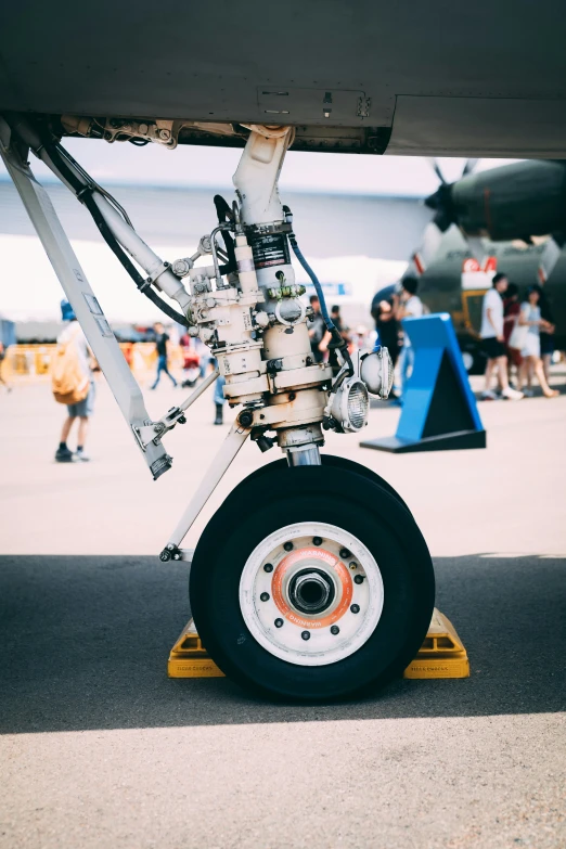 close up view of a propellor on the bottom of a military plane