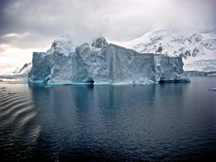 the huge iceberg has been partly submerged in the water