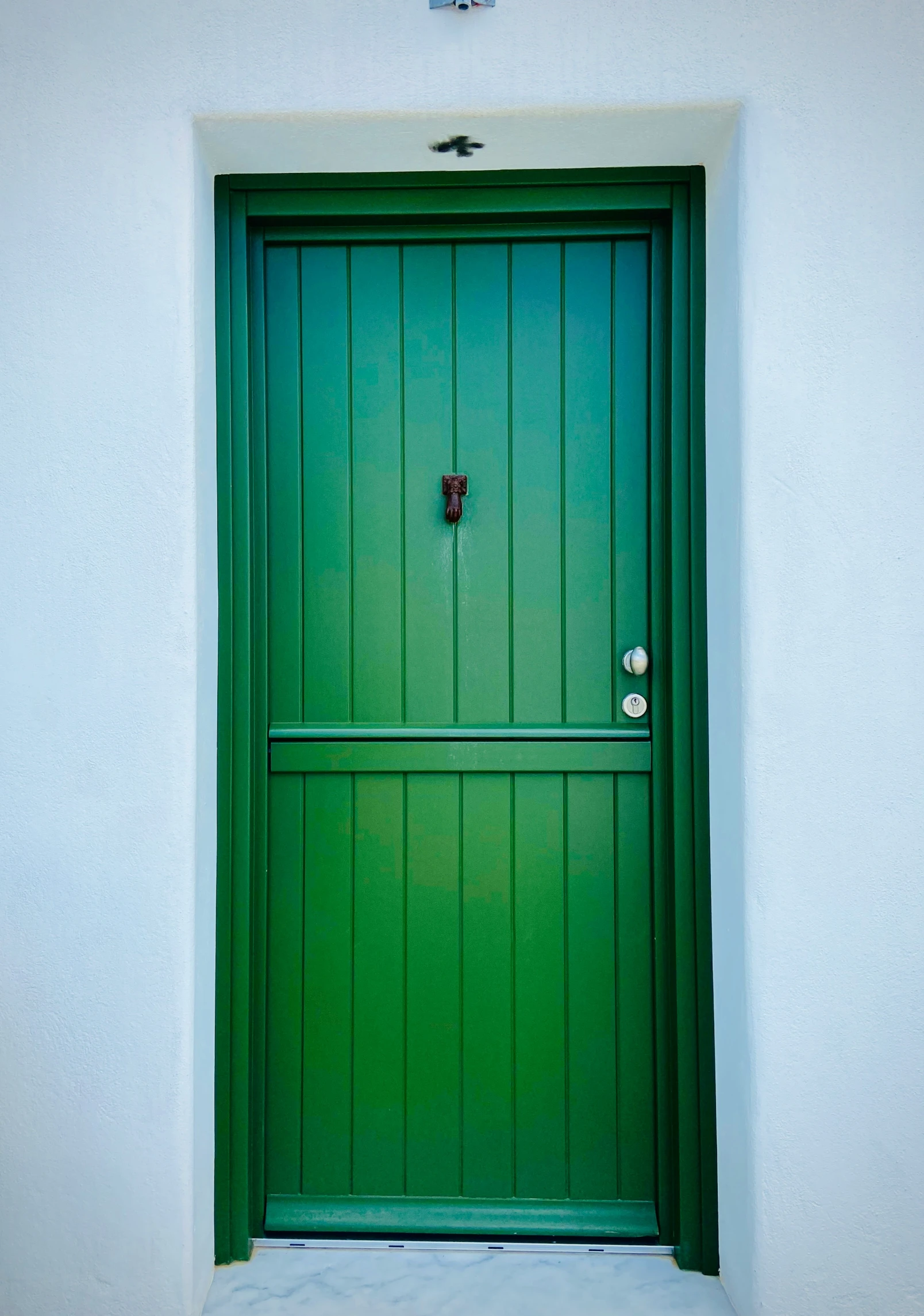 a door to an apartment with a large frame