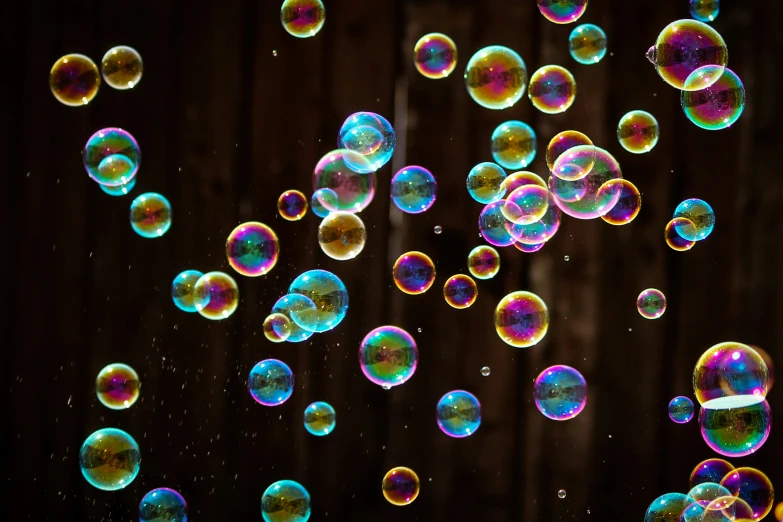 a bunch of soap bubbles are hanging up
