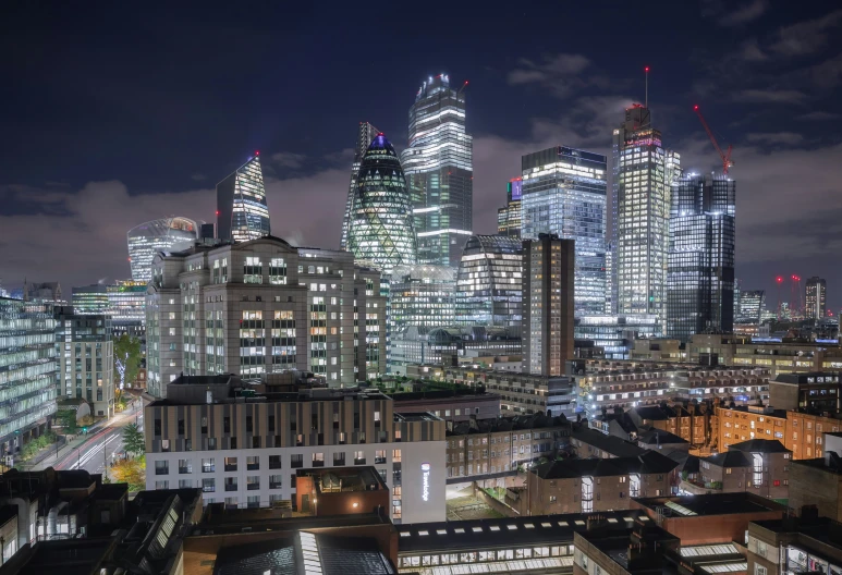 the skyscrs at night lit up against the sky