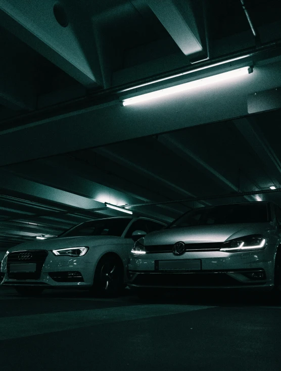 an automobile driving through an underground parking garage