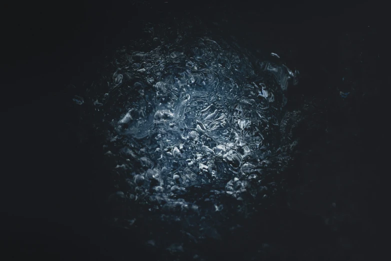 close up of a dark, dirty substance, or substance that appears to be water