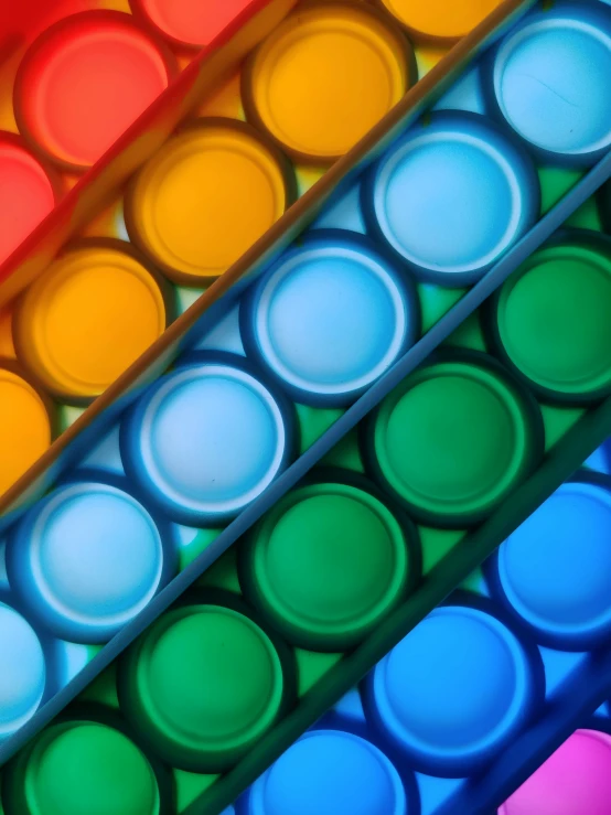 a close up of different colored plastic cups