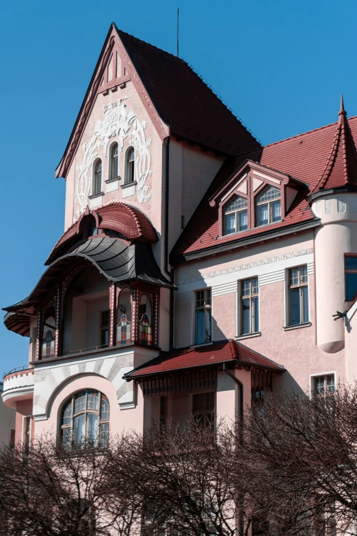 a clock stands in front of a building with some large windows