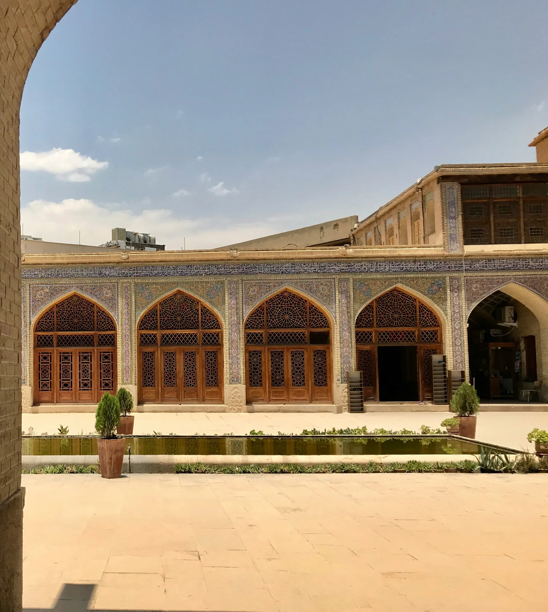 view from an arch to a beautiful building