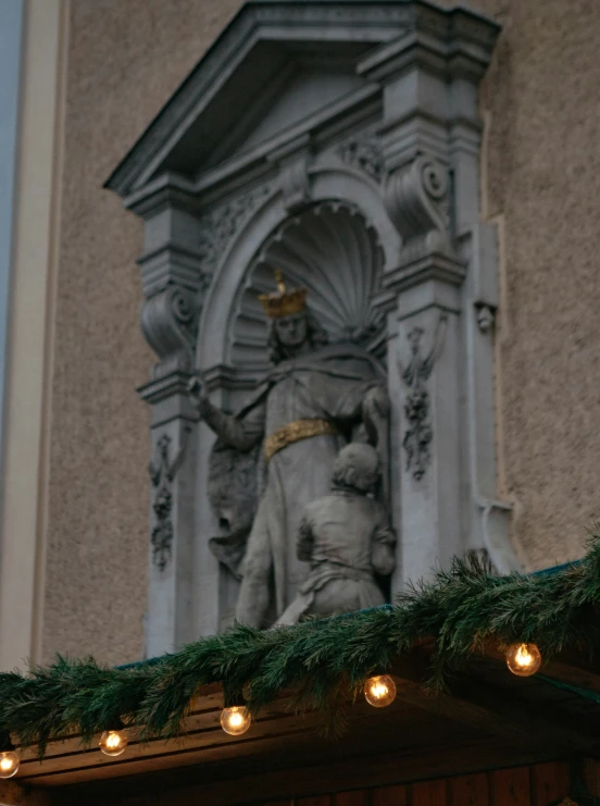 an elaborately decorated clock tower with christmas decorations on it