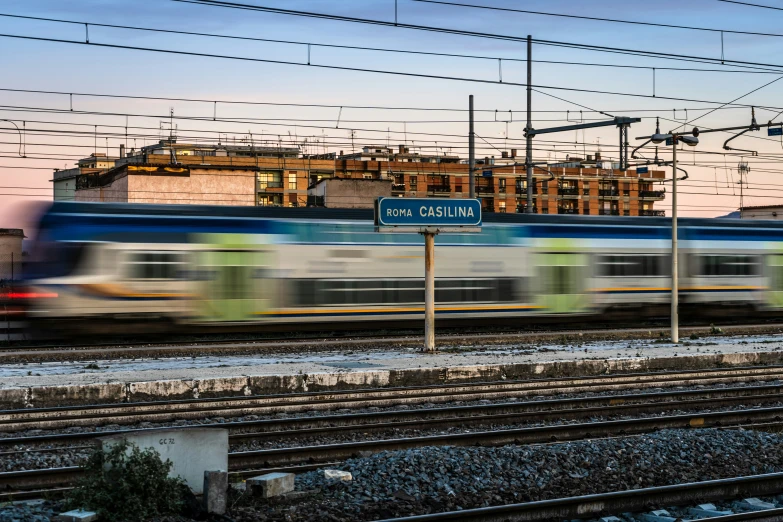 a blue train is going down the track