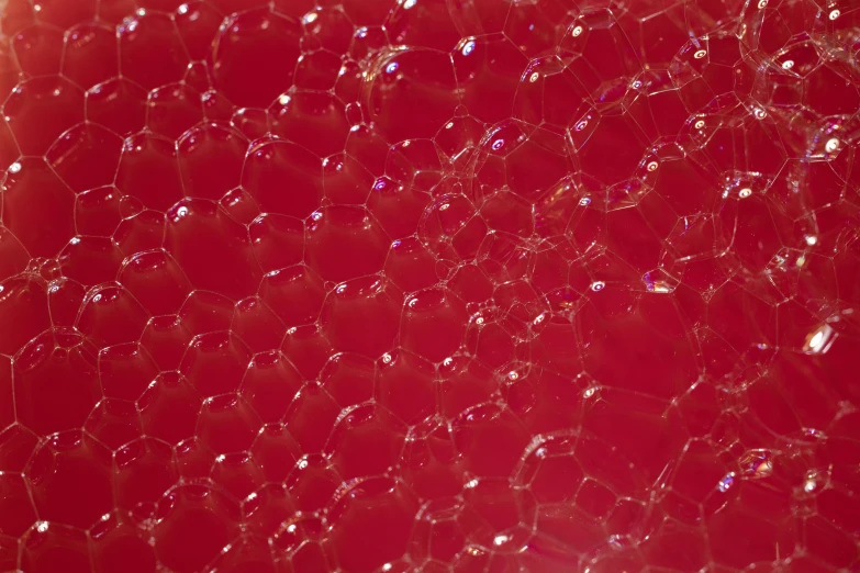 a background image of a bunch of shiny red material