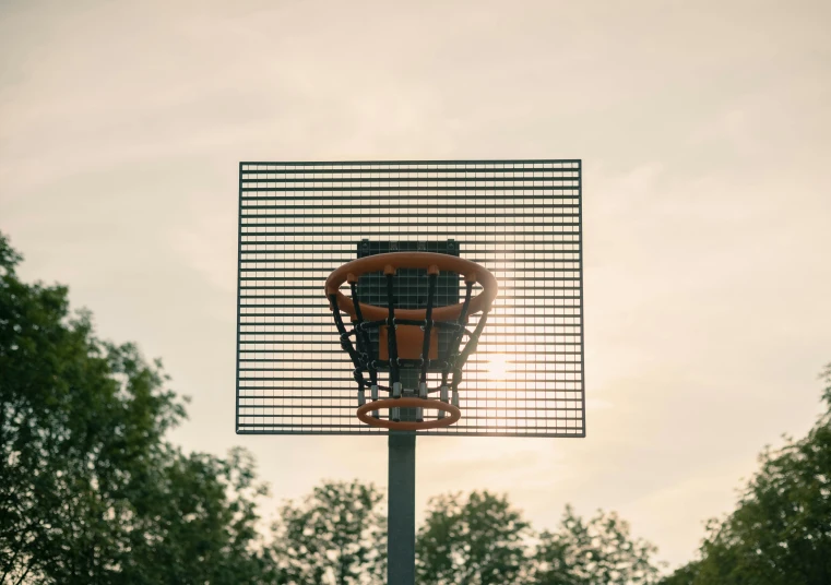 the top of a building with trees in the background