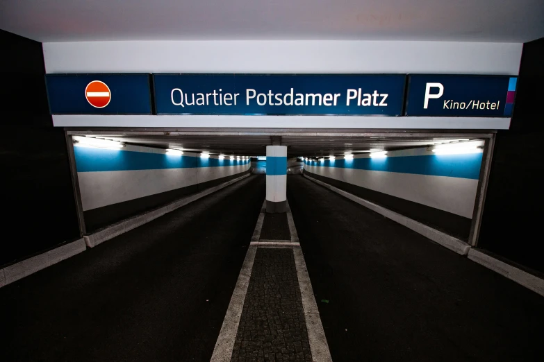 a parking lot with the signage of a german plan