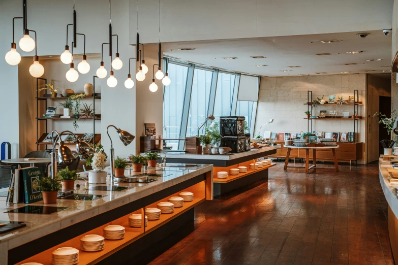 the inside of an empty restaurant with lots of dishes on the table