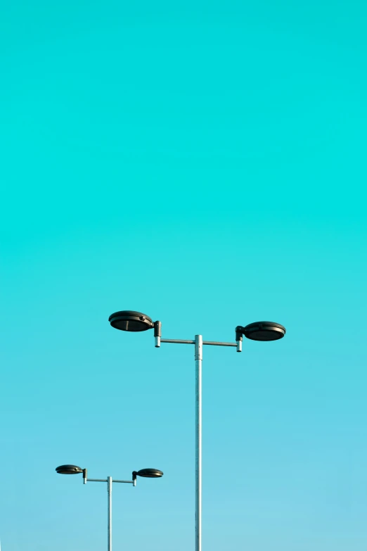 street lights on poles against the blue sky