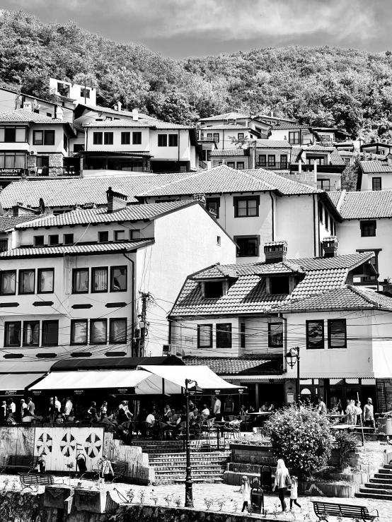 black and white picture of rooftops in a city