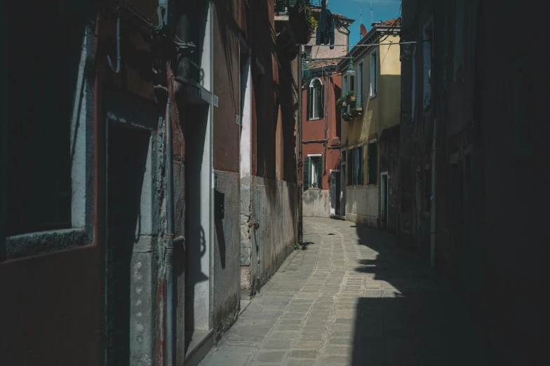 the view down a narrow street from an alley