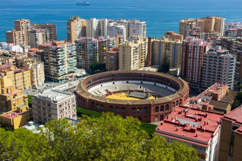 a stadium in a city overlooking the ocean