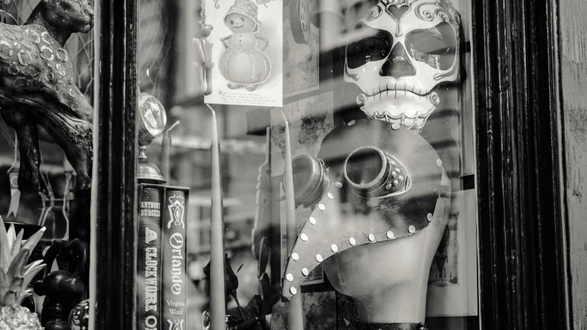 a black and white po of a mexican skull in a store front window