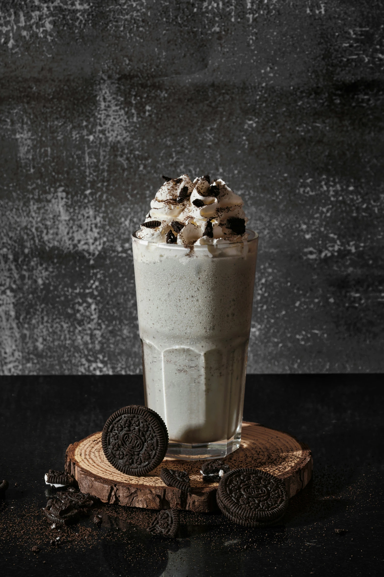 a cup of food and a cookie on a table