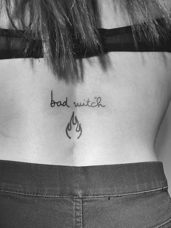 someone's badwater tattoo on their lower back