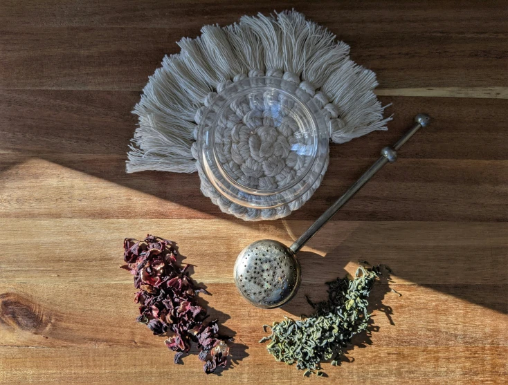 several herbs sitting on top of wooden counter