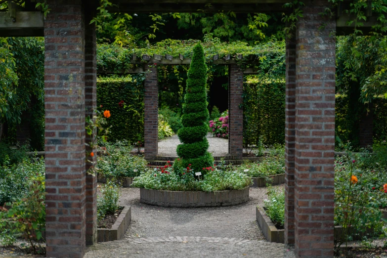 the stone pillars have flowers growing on them