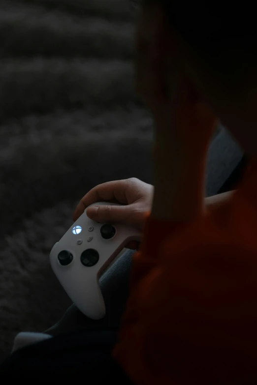 man playing with a controller in his hand