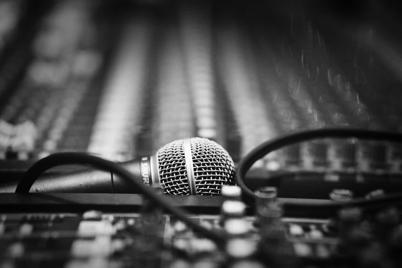 black and white po of a microphone on a desk