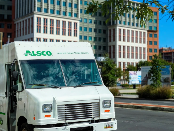 a white food truck parked on the side of the road