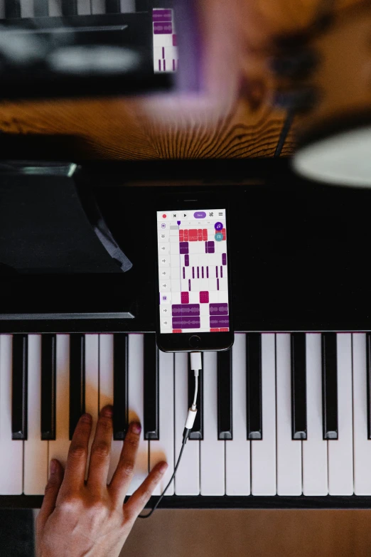 a person is playing the piano with his fingers