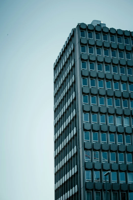 a tall building with many windows is seen