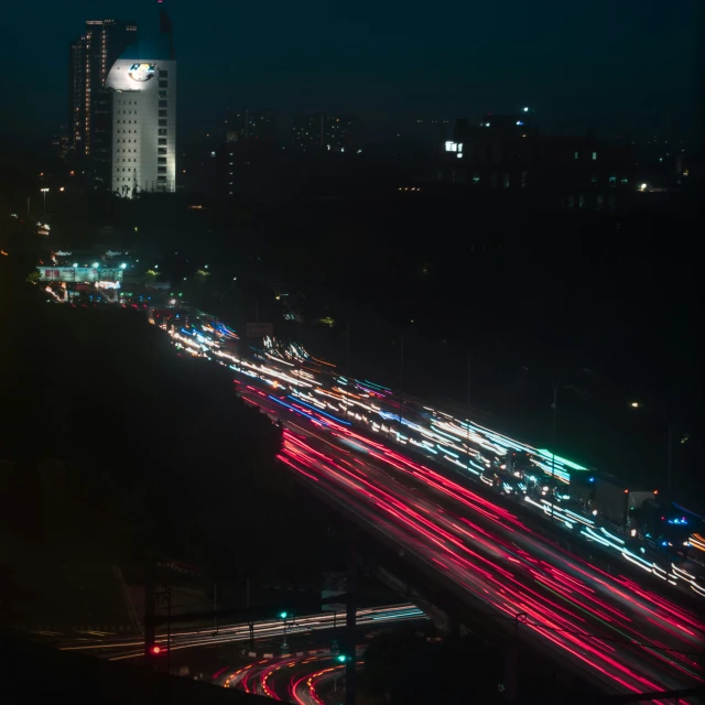 a night scene with a freeway full of traffic