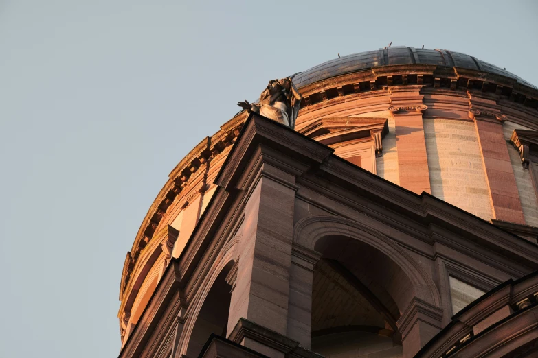 an upward angle s of a building with a blue sky