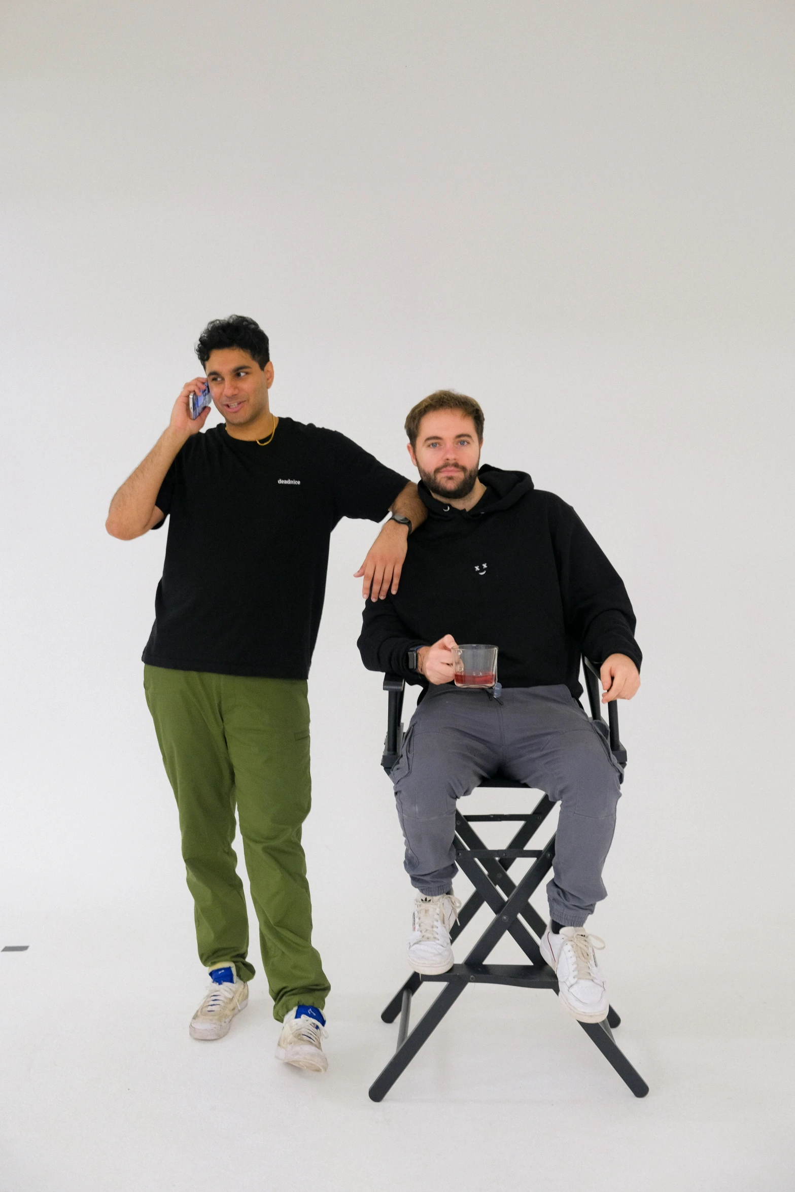 a couple of people sitting on top of a chair