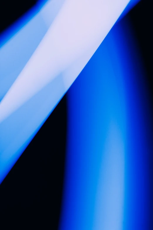 a pograph of a large toothbrush on blue background