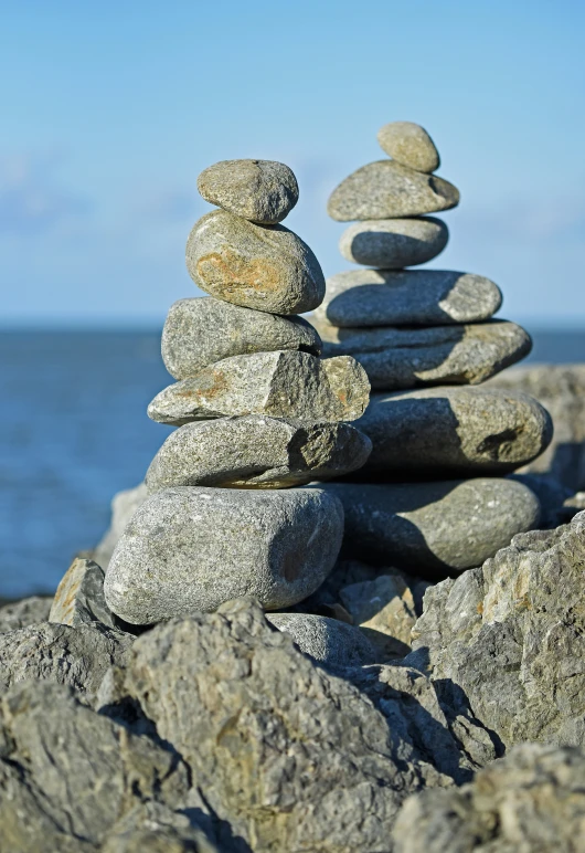 the stack of stones are on top of each other